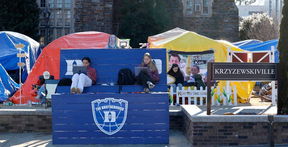 Duke freshman Ashley Aufderheide, left and senior Lily Kempczinski work in Krzyzewskiville at Duke University in Durham, N.C., Tuesday, Jan. 28, 2025. The is the 39th year of tenting for students who want to attend the game against UNC. One hundred thirty tents were set up on Jan. 12, with 12 students per tent. It is the only way undergraduates can go to the game.
