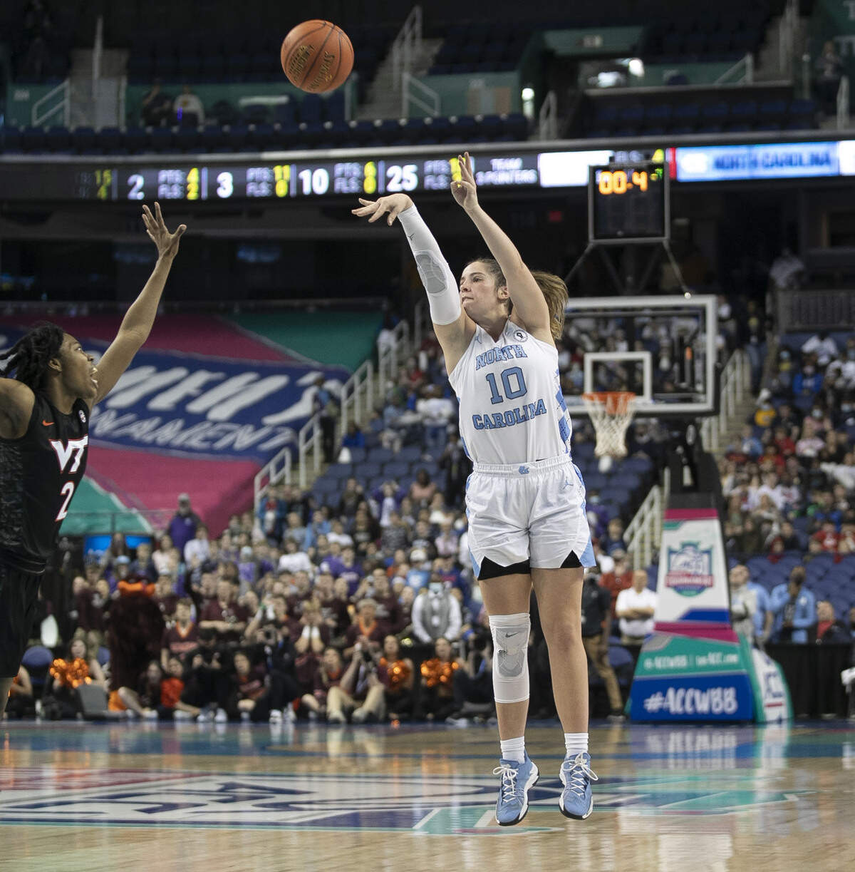 North Carolina’s Alyssa Ustby (1) launches a three-point shot with 0.4 second to play to tie Virginia Tech and force an overtime period during the quarterfinal of the ACC Women’s Tournament on Friday, March 4, 2022 at the Greensboro Coliseum in Greensboro, N.C.