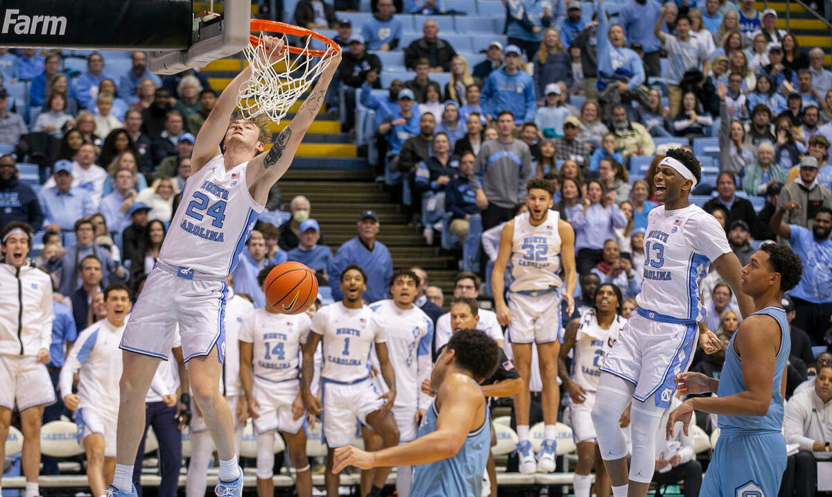 North Carolina’s Tyler Nickel (24) dunks on a fast break after making a steal from The Citadel’s Jackson Price (0) in the second half on Tuesday, December 13, 2022 at the Smith Center in Chapel Hill, N.C. Nickel came off the bench to score 16 points in their 100-67 victory.