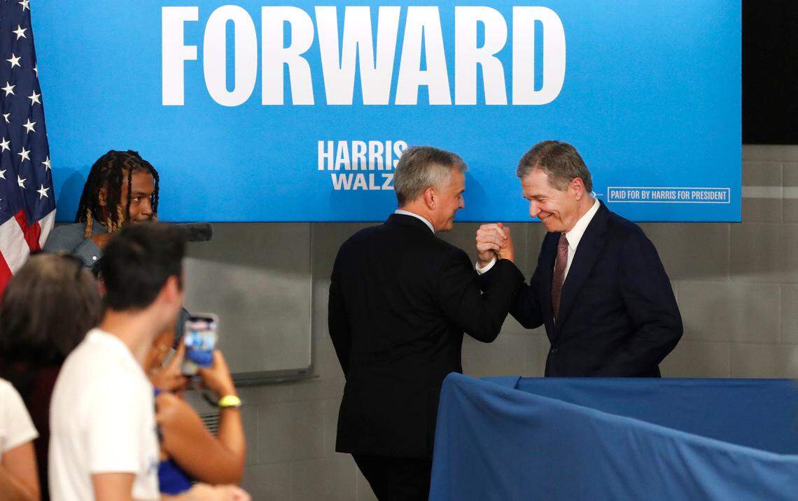 Gov. Roy Cooper greets Attorney General Josh Stein, who is running for governor, after Stein spoke during an event for Vice President and Democratic nominee for president Kamala Harris in Raleigh, N.C., Friday, August 16, 2024.