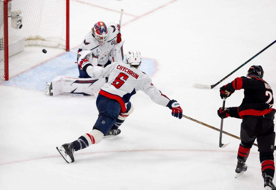 Carolina Hurricanes defenseman Sean Walker (26) scores to take a 4-2 lead over the Washington Capitals in the third period during Game 4 of their series on Monday, May 12, 2025 at Lenovo Center in Raleigh, N.C.