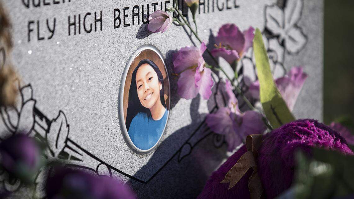 A photograph of Hania Aguilar was included on her headstone, pictured here on Tuesday, April 23, 2019. The community raised the funds to pay for the headstone, which is now surrounded by purple and pink decorations.