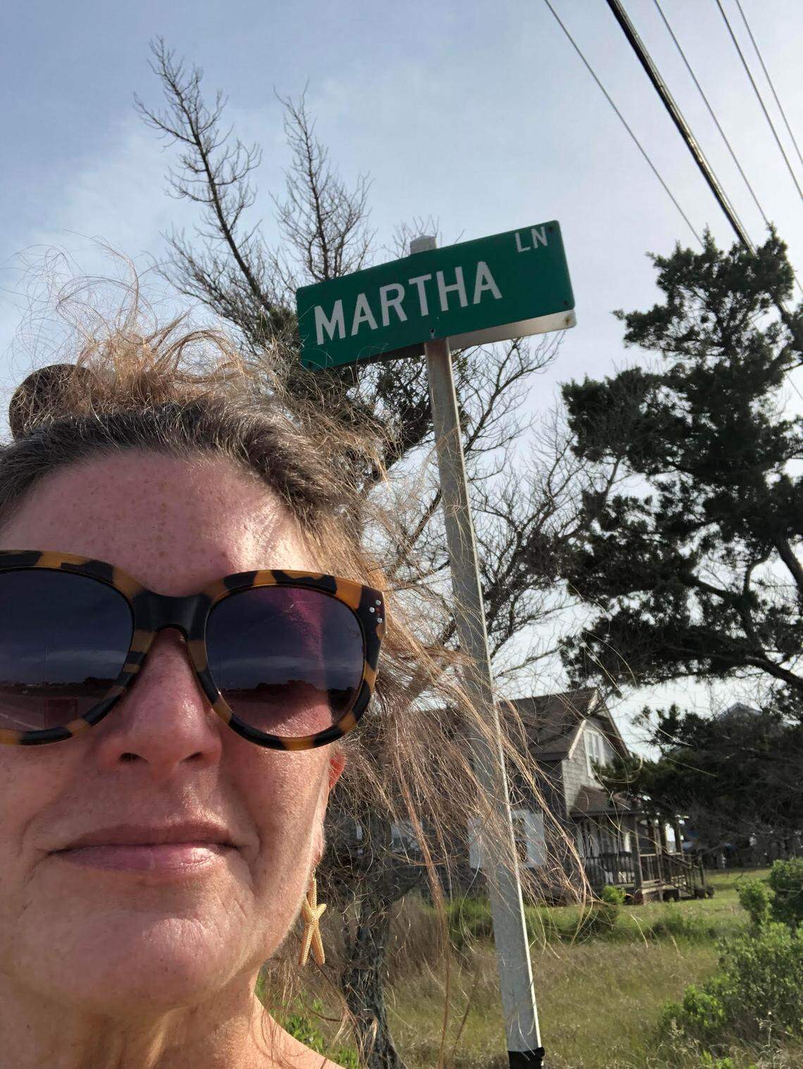 Reporter Martha Quillin at the intersection of N.C. 12 and Martha Lane in Hatteras.