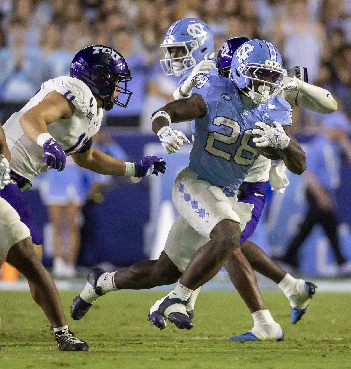 North Carolina running back Benjamin Hall (28) breaks open through the TCU defense for a 10 yard gain in the second quarter on Monday, September 1, 2025 at Kenan Stadium in Chapel Hill, N.C.