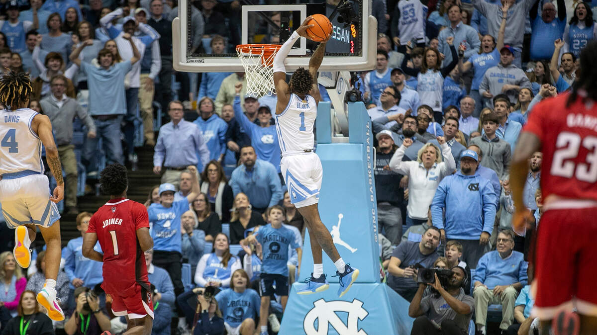 North Carolina’s Leaky Black (1) breaks to the basket for a dunk on a fast break in the first half against N.C. State on Saturday, January 21, 2023 at the Smith Center in Chapel Hill, N.C.