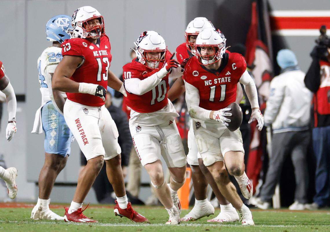 N.C. State linebacker Payton Wilson (11) heads back to the sideline after intercepting the ball during the second half of N.C. State’s 39-20 victory over UNC at Carter-Finley Stadium in Raleigh, N.C., Saturday, Nov. 25, 2023.