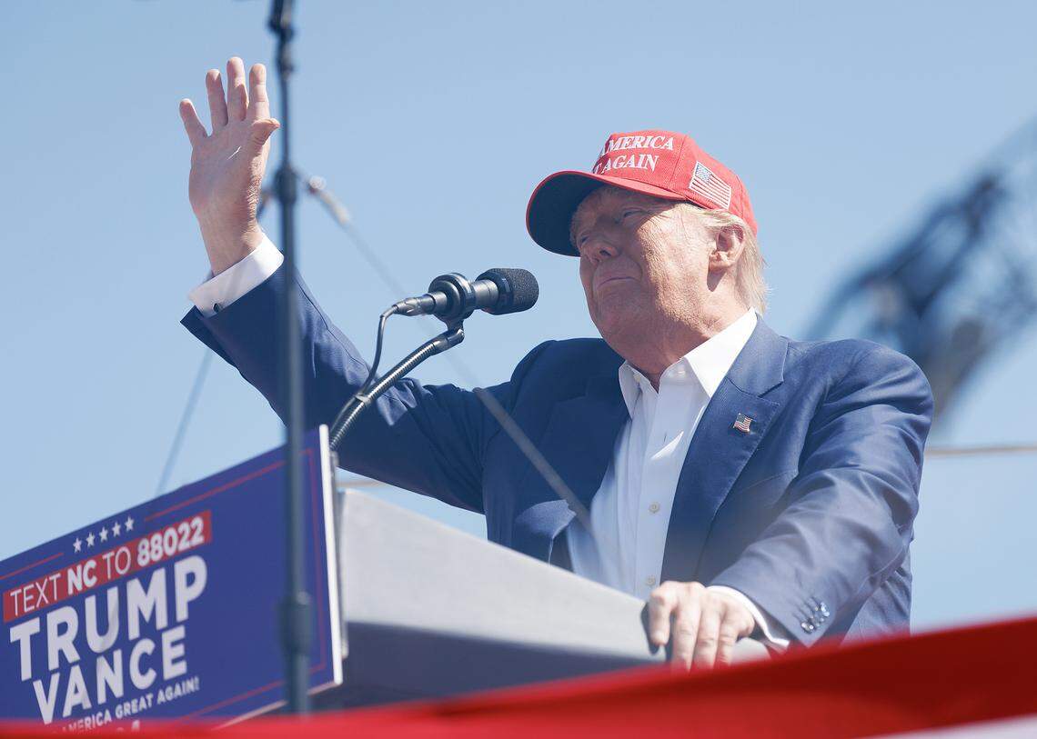 Former President and current Republican candidate for president Donald Trump acknowledges the crowd after arriving to a rally in Wilmington, N.C. on Saturday, Sept. 21, 2024.