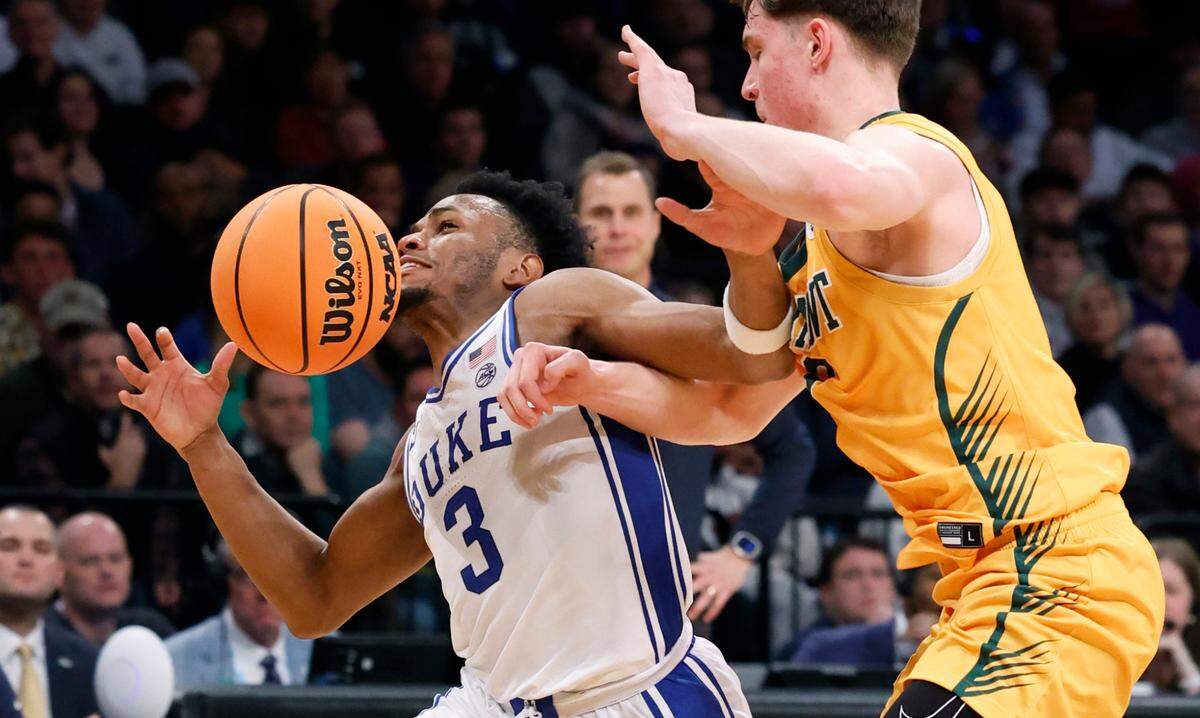 Duke’s Jeremy Roach (3) keeps the ball from Vermont’s TJ Hurley (3) during the second half of Duke’s 64-47 victory over Vermont in the first round of the NCAA Tournament at the Barclays Center in Brooklyn, N.Y., Friday, March 22, 2024.