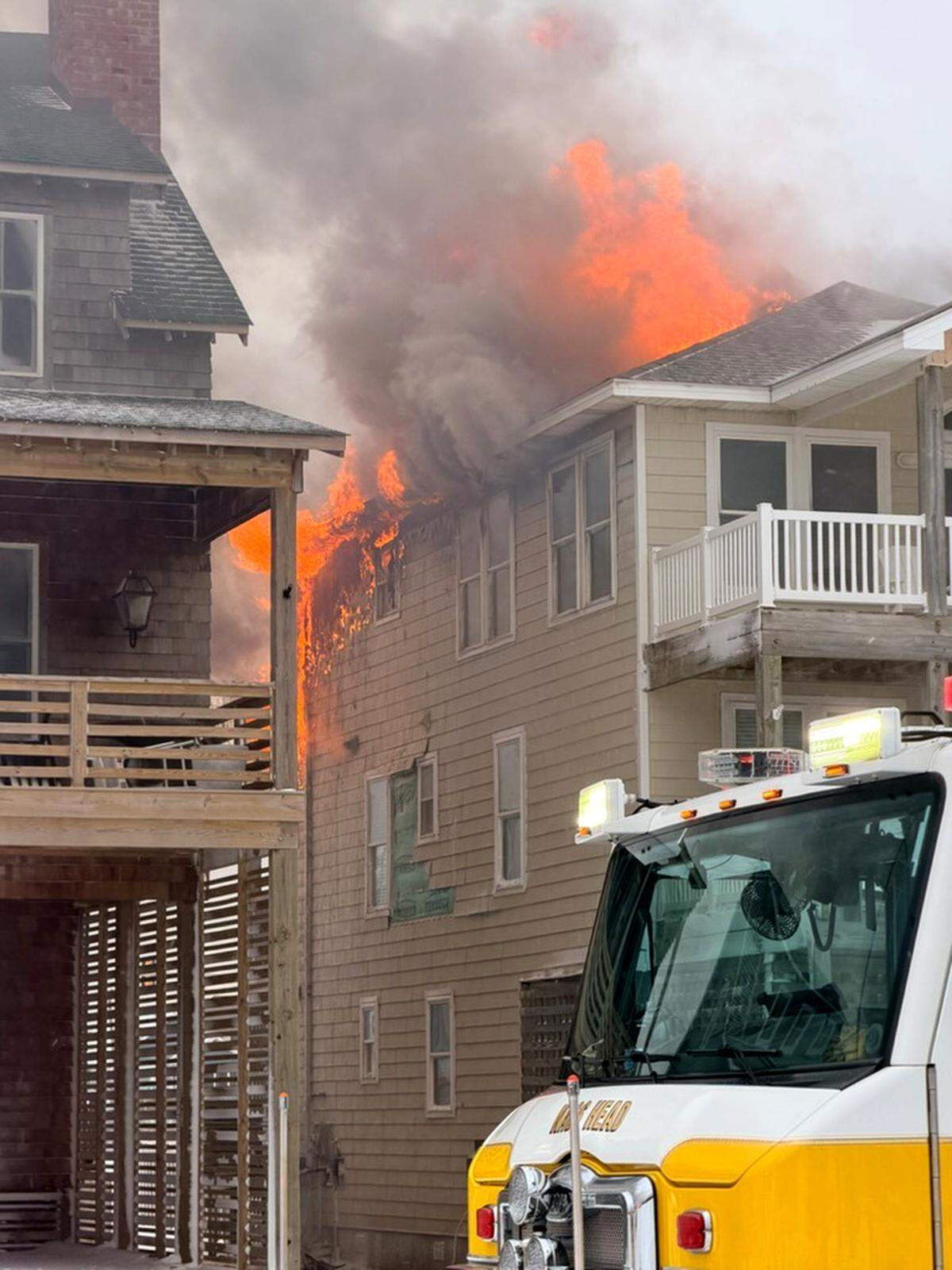 Fire ripped through a beach house in Nags Head, N.C., Sunday, as firefighters battled high winds, snow and ice.