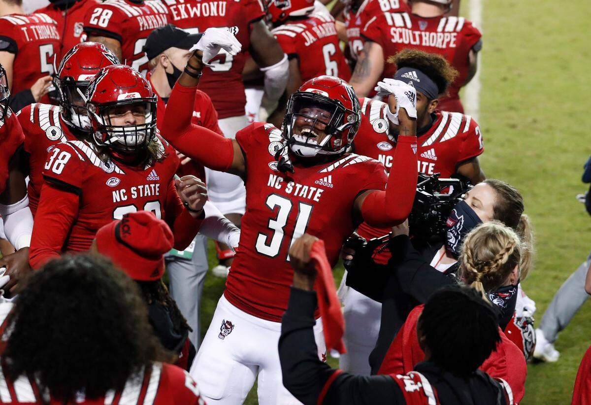 N.C. State’s Vi Jones (31) celebrates after Jones blocked the field goal attempt by Liberty’s Alex Barbir during the second half of N.C. State’s 15-14 victory over Liberty at Carter-Finley Stadium in Raleigh, N.C., Saturday, Nov. 21, 2020.