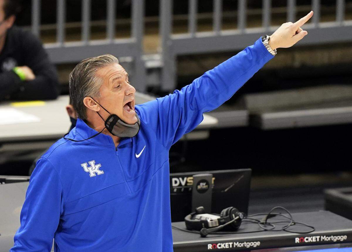 Kentucky head coach John Calipari yells instructions to players in the first half of an NCAA college basketball game against North Carolina, Saturday, Dec. 19, 2020, in Cleveland.