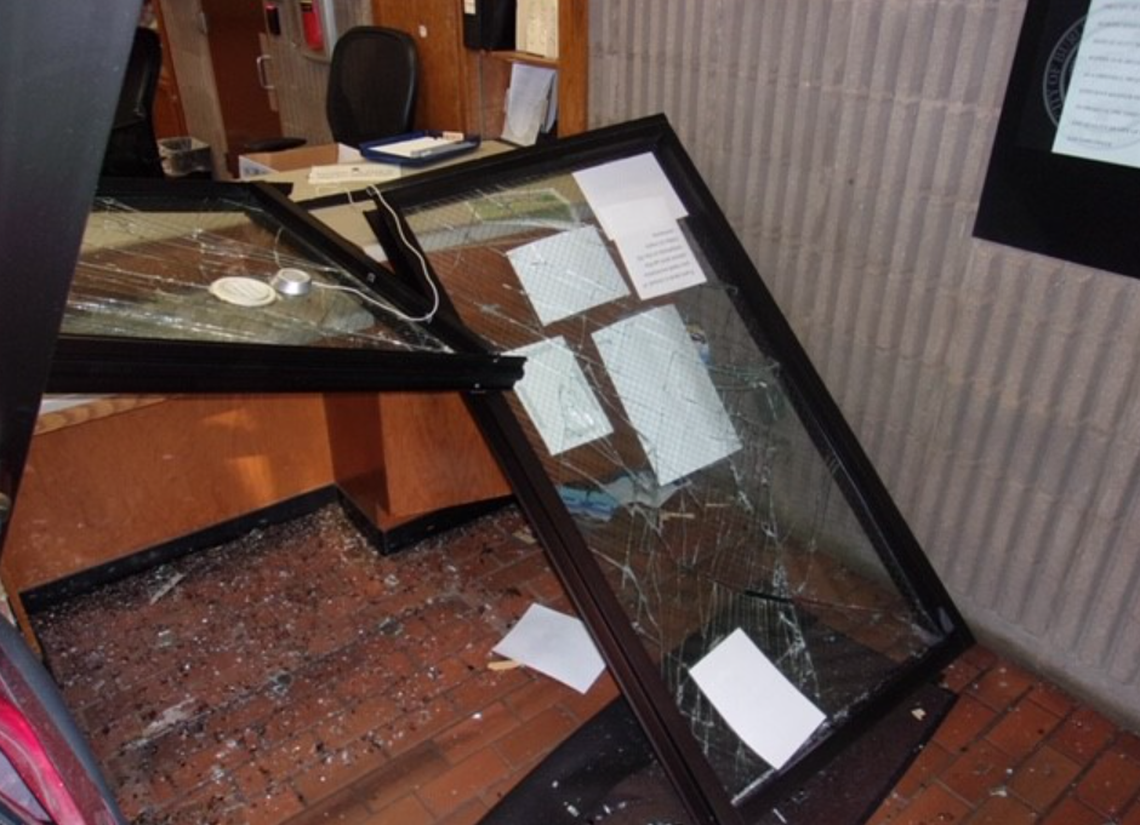 The force of the minivan crashing through the front entrance punched these windows several feet into the lobby.