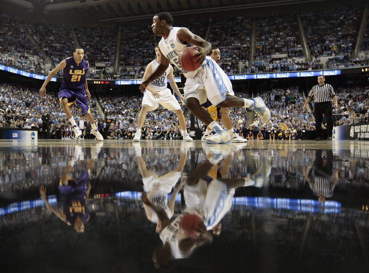 North Carolina guard Ty Lawson (5) drives the baseline in the second half against LSU at the NCAA tournament in Greensboro,NC Saturday March 21, 2009.Lawson scored 23 points in the Tar Heels 84-70 victory.CHUCK LIDDY-chuck.liddy@newsobserver.com