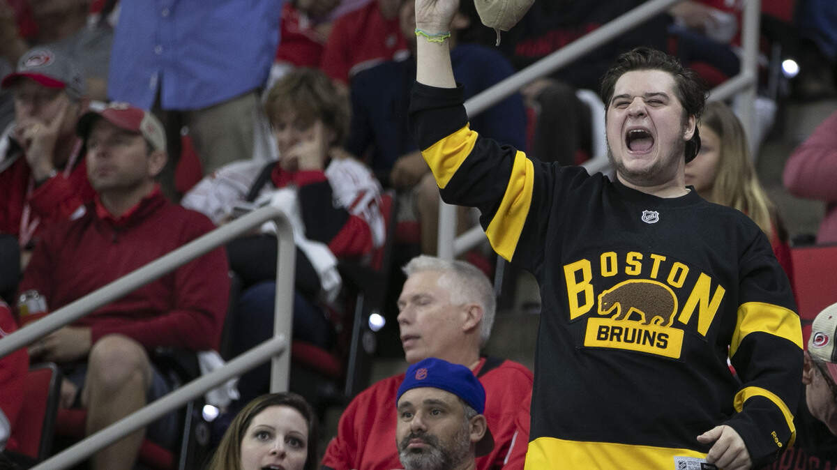 Boston Bruins fan Lee O’Rourke of Fuquay-Varina celebrates after the Bruins scored securing a 3-0 lead over the Carolina Hurricanes during the third period in Game 4 of the Eastern Conference Finals on Thursday, May 16, 2019 at PNC Arena in Raleigh, N.C.