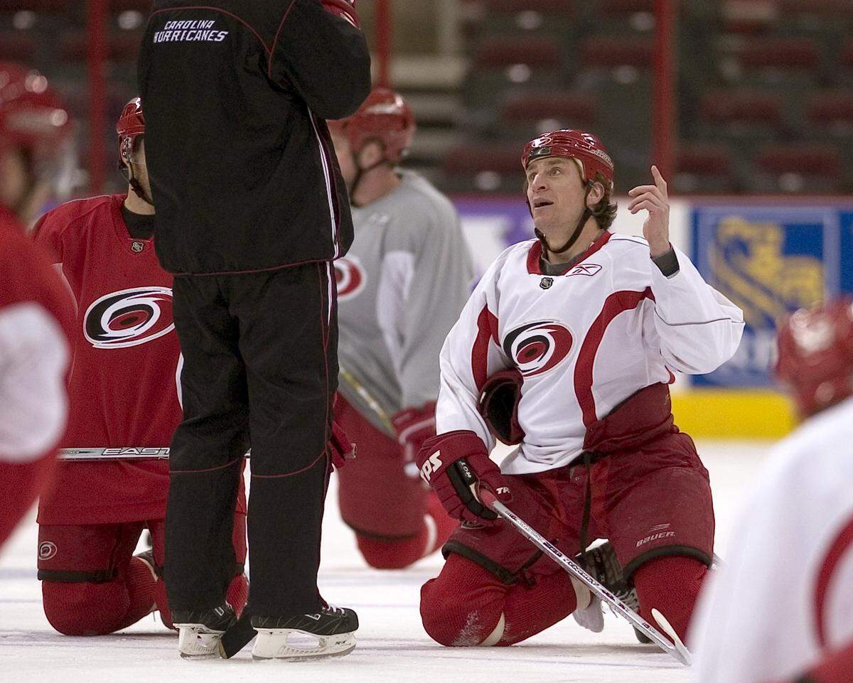CANES10.SP.050406.RTW--Raleigh, N.C.--Hurricanes Captain Rod Brind'Amour (17) talks with assistant coach Jeff Daniels during practice on Thursday May 4, 2006 at the RBC Center.  stf/Robert Willett