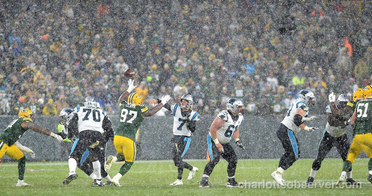 Carolina Panthers quarterback Kyle Allen, center, throws toward tight end Greg Olsen during the fourth quarter Sunday in Carolina’s 24-16 loss to Green Bay. Olsen became the fifth NFL tight end to go over the 700-reception mark during the game.