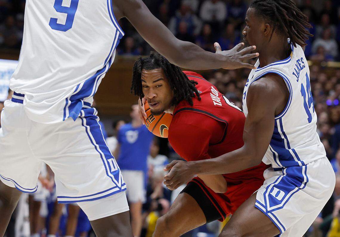 Duke’s Khaman Maluach and Sion James pressure N.C. State’s Jayden Taylor during the second half of the Wolfpack’s 74-64 loss on Monday, Jan. 27, 2025, at Cameron Indoor Stadium in Durham, N.C.