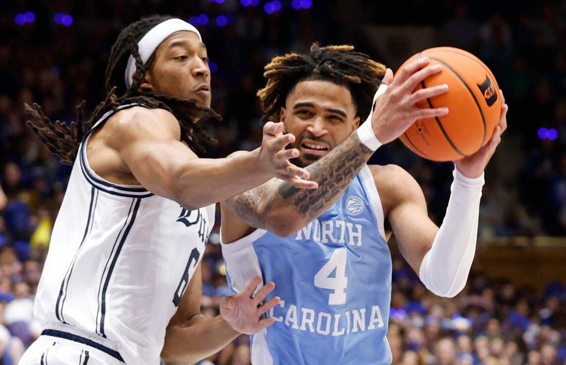 North Carolina’s RJ Davis (4) drives past Duke’s Maliq Brown (6) during the first half of Duke’s game against UNC at Cameron Indoor Stadium in Durham, N.C., Saturday, Feb. 1, 2025.