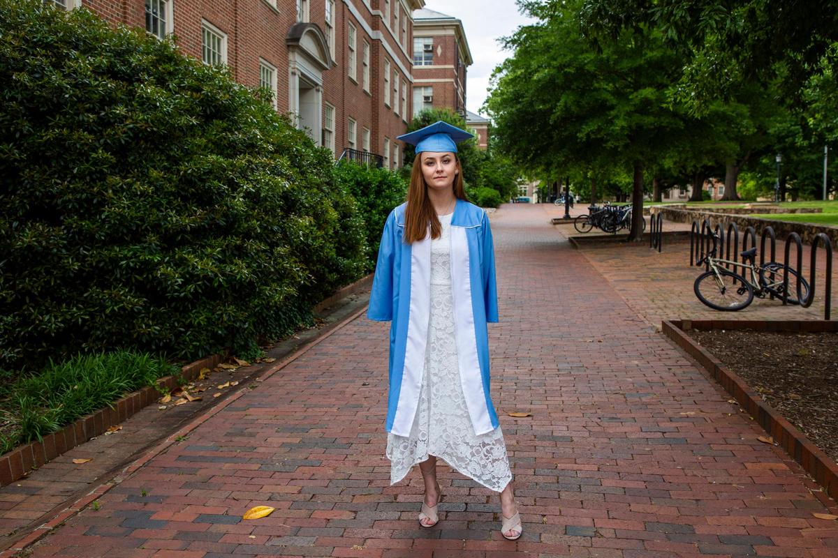 Amy Waldron, 22, stands for a portrait in the cap and gown she wouldÕve worn to her graduation ceremony to celebrate earning her degree in psychology at UNC Chapel Hill, on Wednesday, May 6, 2020, in Raleigh, N.C.