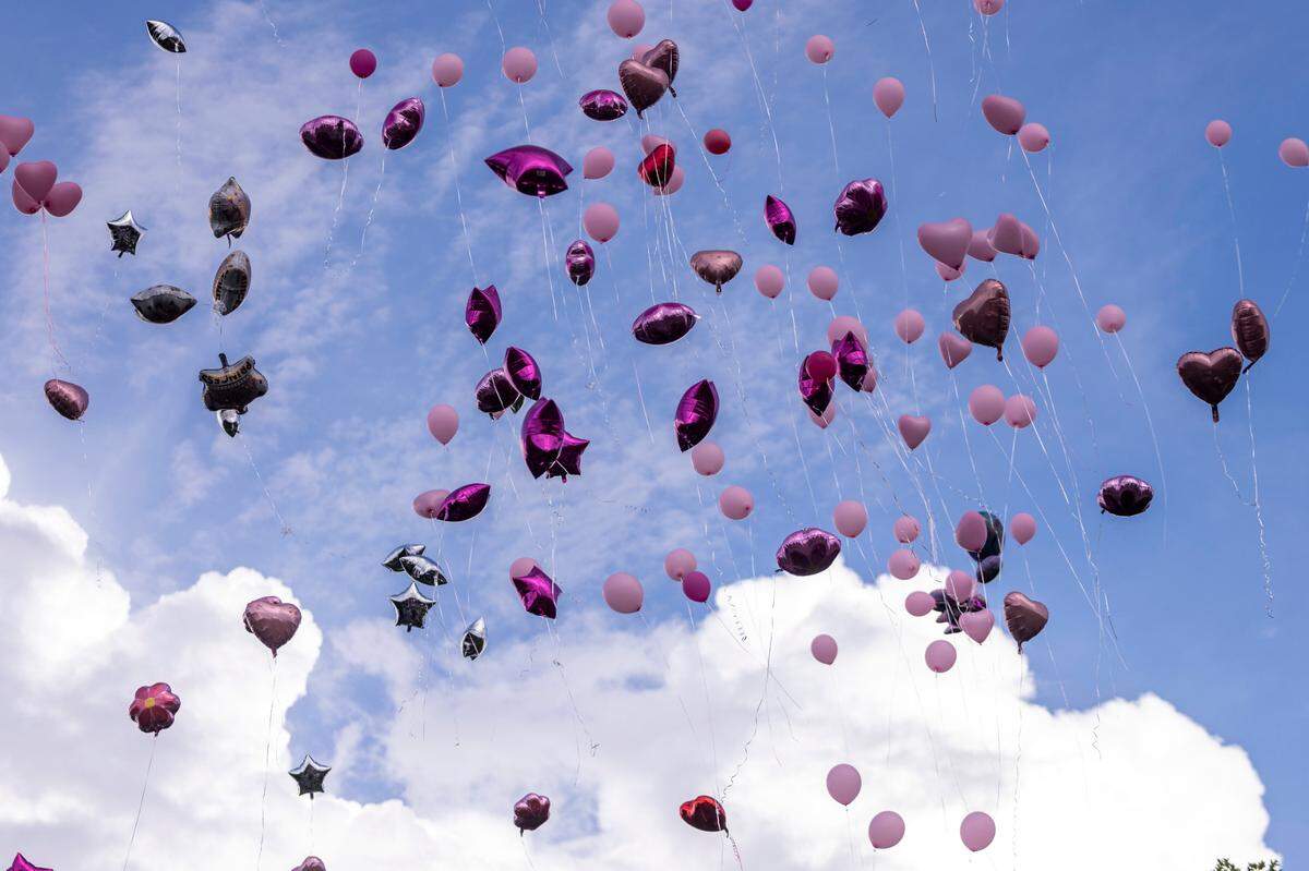 Balloons drift away during a vigil for 5-year-old Khloe Fennell Friday, July 7, 2023 in Durham. Fennell was shot and killed on Wednesday. Her 15-year-old cousin was babysitting her. She was shot multiple times and survived.