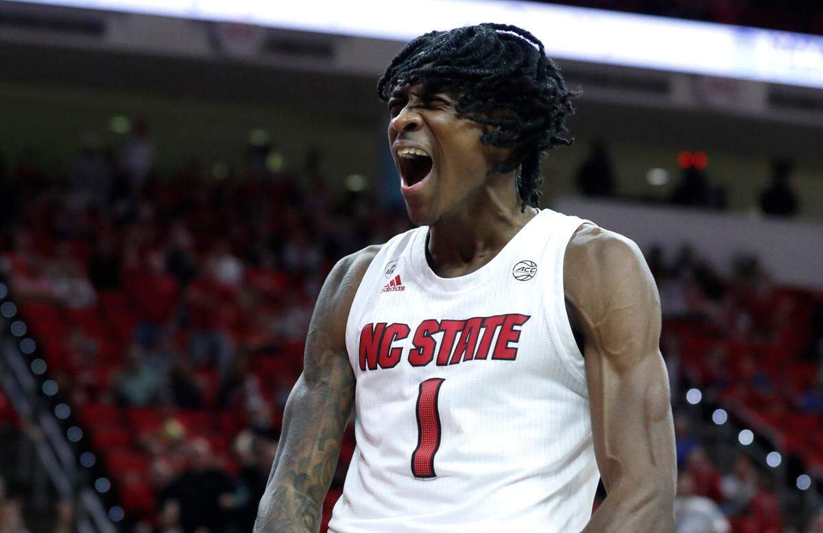 N.C. State’s Dereon Seabron (1) celebrates after making the basket while being fouled during the second half of Louisville’s 73-68 victory over N.C. State at PNC Arena in Raleigh, N.C., Saturday Dec. 4, 2021.