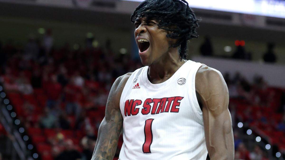 N.C. State’s Dereon Seabron (1) celebrates after making the basket while being fouled during the second half against Louisville’ at PNC Arena in Raleigh, N.C., on Saturday Dec. 4. Seabron led the way for the Wolfpack against Richmond on Friday night.
