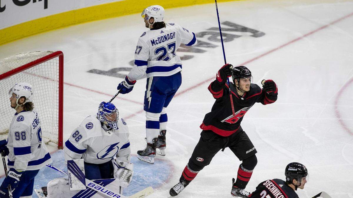 Carolina Hurricanes’ Jesper Fast (71) reacts after a goal by teammate Jake Bean (24) to tie Tampa Bay 1-1 in the third period of game one of their second round Stanley Cup series on Sunday, May 30, 2021 at PNC Arena in Raleigh, N.C.