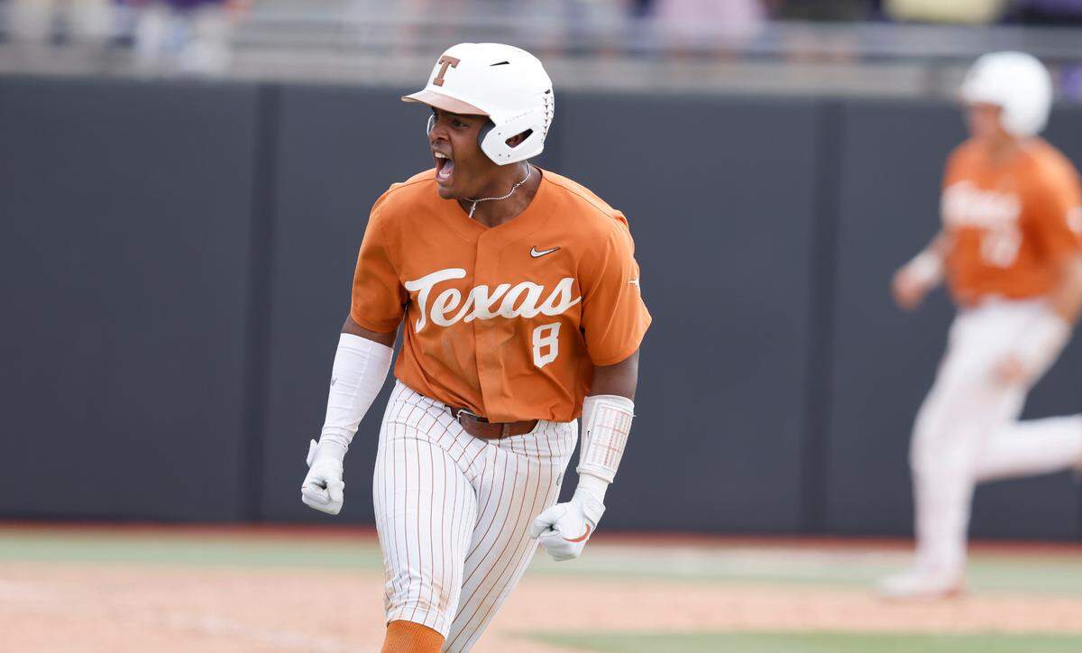 Texas’ Dylan Campbell (8) celebrates after hitting a RBI single in the ninth inning to give Texas a 9-8 victory over ECU in the Greenville Super Regional at Clark-LeClair Stadium Saturday, June 11, 2022.