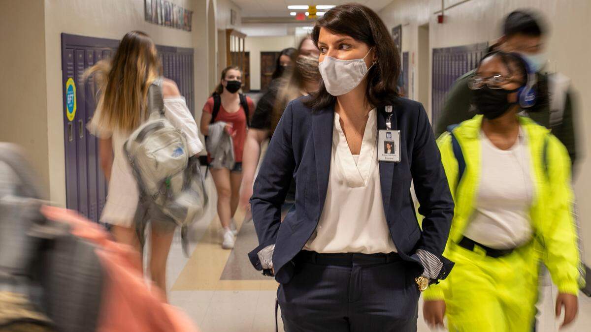 Principal Dr. Elena Ashburn keeps as eye on students as they head to lunch at Broughton High School where more than 1,200 students returned for in-person classes on Thursday, April 8, 2021. Under Wake County Schools’ Plan A, this is the most most students to be on campus in more than a year due to the COVID-19 pandemic.