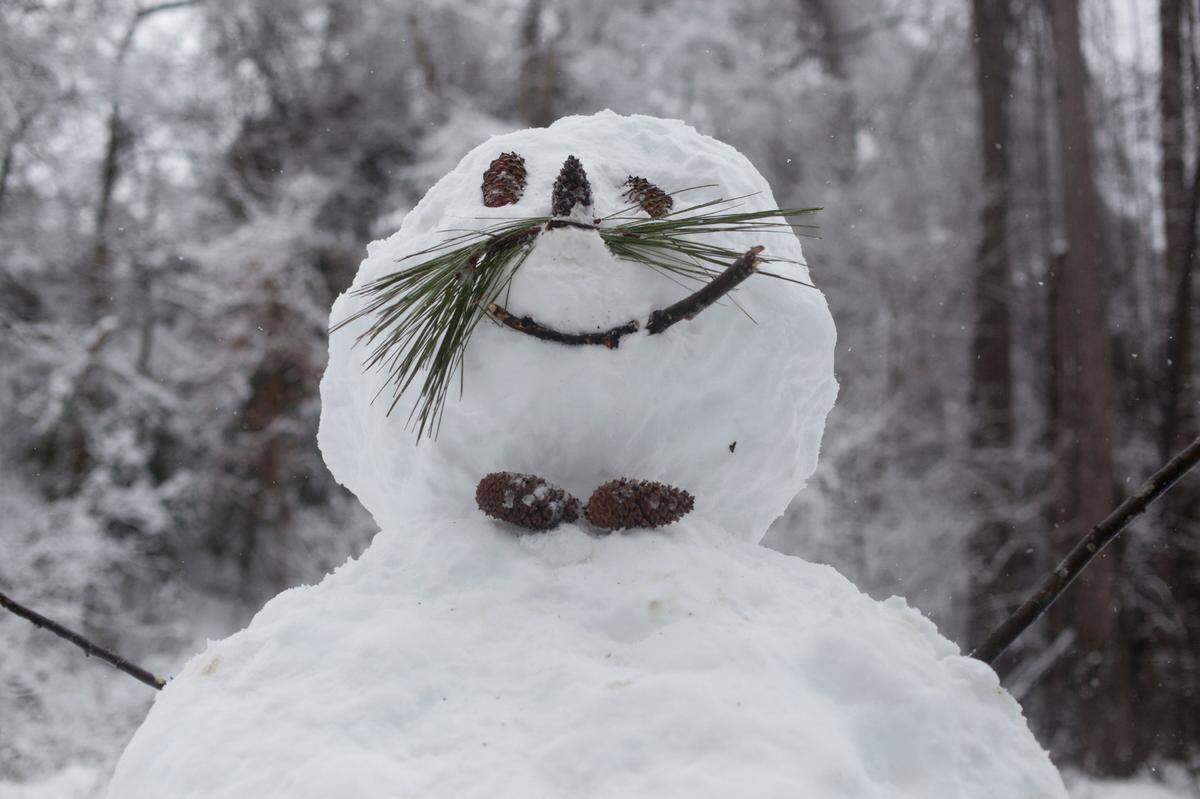 The finished snowman that is the work of Emily and Brendan Payne, Caroline and Ryan Pickens, and Nichole and Matt Horn.