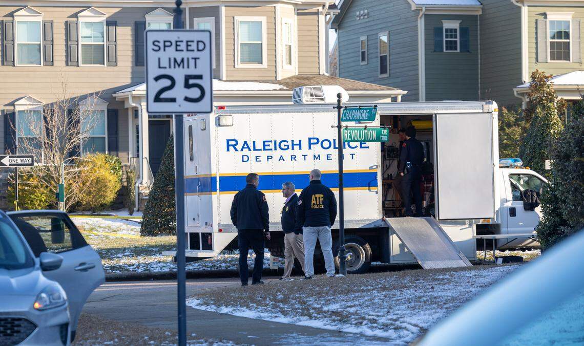 Raleigh Police and ATF agents are shown at Chapanoke Road and Revolution Circle on Wednesday afternoon, January 22, 2025 in Raleigh, N.C. Police are still conducting their investigation in the neighborhood where a domestic shooting took two lives and injured a Raleigh Police Officer on Tuesday night. On Wednesday Raleigh Police asked residents to shelter in place during their investigation.
