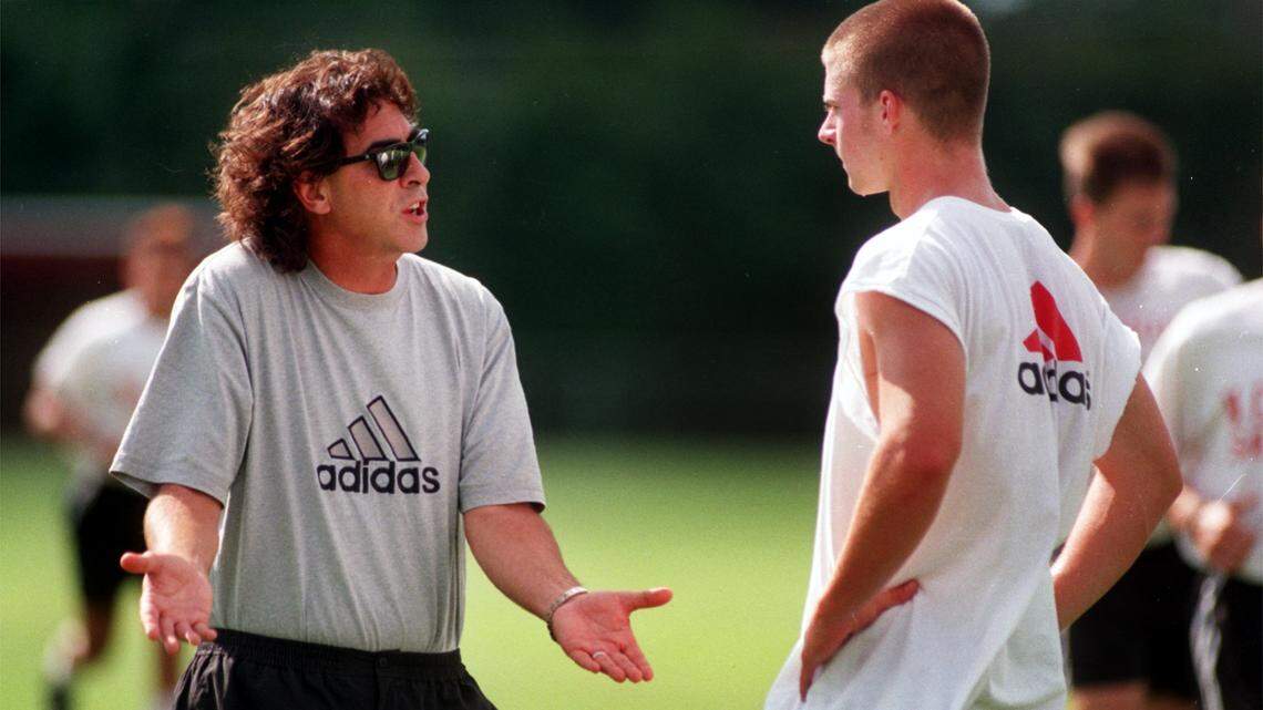N.C. State soccer coach George Tarantini encourages his player during practice in 1999.