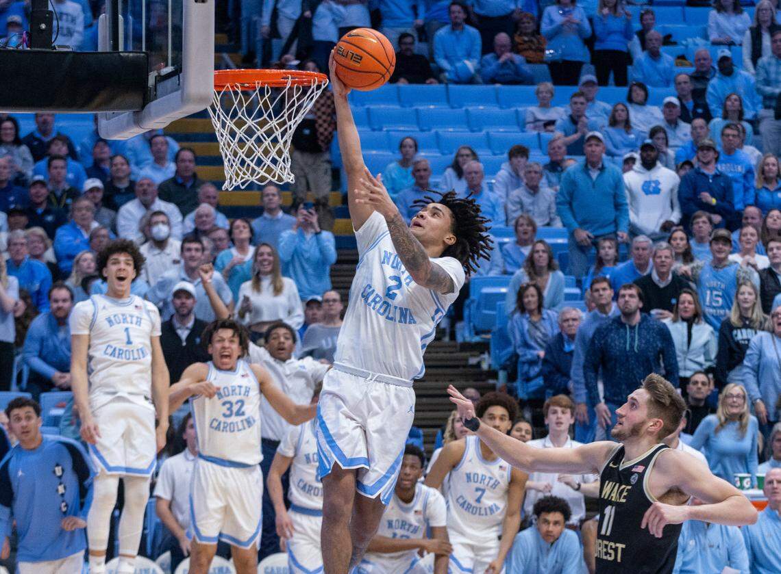 North Carolina’s Elliot Cadeau (2) breaks to the basket in the second half against Wake Forest’s Andrew Carr (11) on Monday, January 22, 2024 at the Smith Center in Chapel Hill, N.C. Cadeau scored 14 points in the Tar Heels’ victory.
