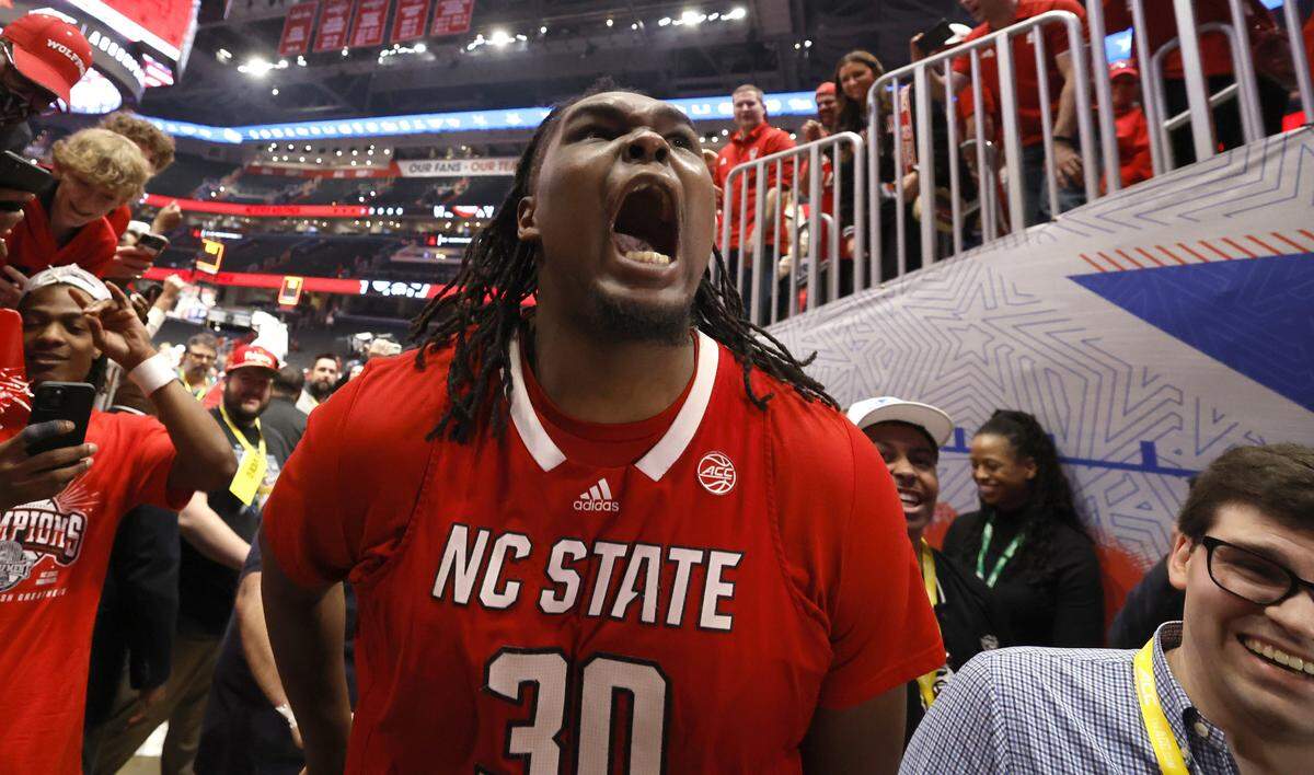 N.C. State's DJ Burns Jr. (30) celebrates as he leaves the floor after N.C. State’s 84-76 victory over UNC in the championship game of the 2024 ACC Men’s Basketball Tournament at Capital One Arena in Washington, D.C., Saturday, March 16, 2024.