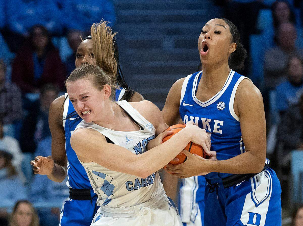 North Carolina’s Lexi Donarski and Duke’s Reigan Richardson battle for possession during overtime of the Tar Heels’ 53-46 win on Thursday, Jan. 9, 2025, at Carmichael Arena in Chapel Hill, N.C.