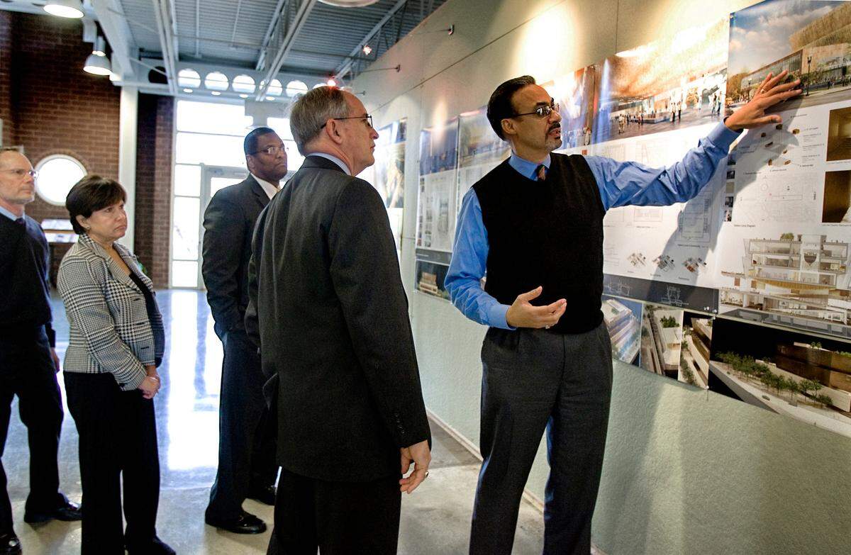 Representatives from The Smithsonian (from left) Jud McIntire, Brenda Sanchez, Mike Bellamy and Bruce Kendall get a tour of The Freelon Group architectural firm in Durham from Phil Freelon, far right in 2009.