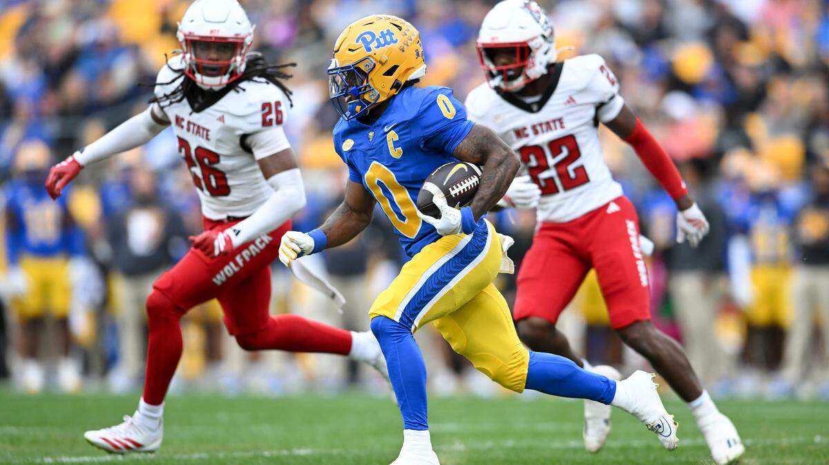 Pitt’s Desmond Reid (0)of carries the ball during the first quarter against the NC State Wolfpack at Acrisure Stadium on October 25, 2025 in Pittsburgh.