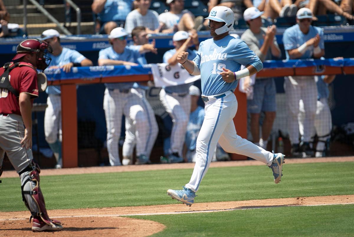 North Carolina’s Aaron Sabato (19) scores on a sacrifice fly by Ashton McGee in the third inning to give the Tar Heels’ a 4-1 lead over Boston College in the semi-finals of the ACC Baseball Championship on Saturday, May 25 2019 at Durham Bulls Athletic Park in Durham, N.C.