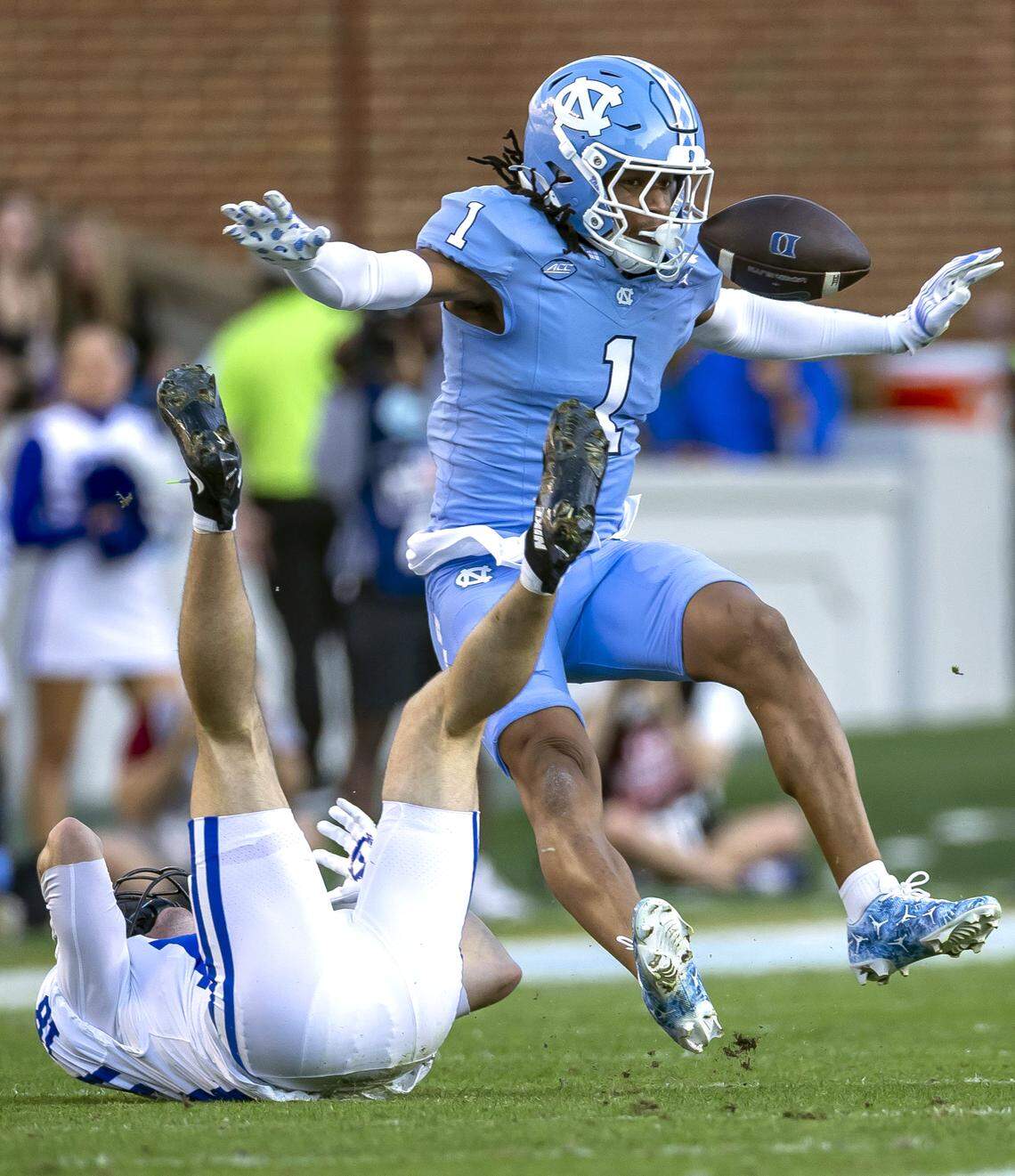 North Carolina defensive back Thaddeus Dixon (1) defends Duke wide receiver Cooper Barkate (18) in the first quarter on Saturday, November 22, 2025 at Kenan Stadium in Chapel Hill, N.C.