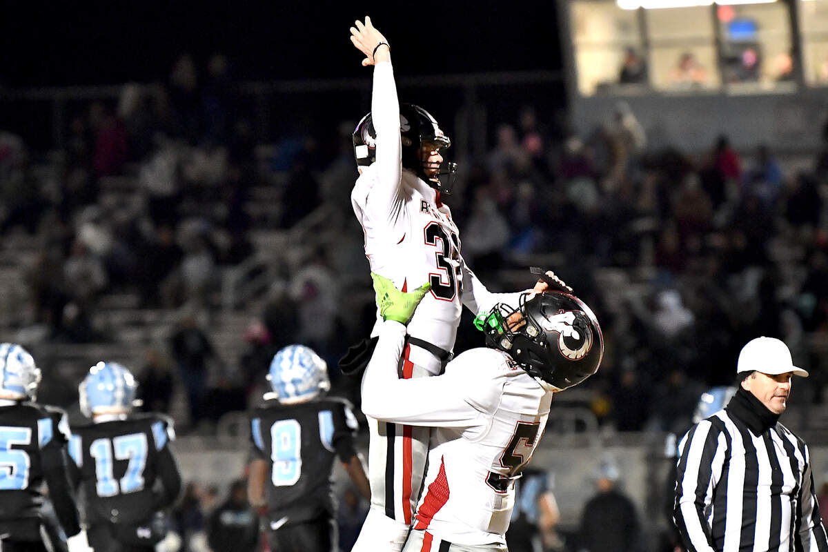 Rolesville’s Tyshon Jackson (54) hists up and celebrates witk kicker Riley Daniels (36) after his field goal against Cleveland . The Rolesville Rams and the Cleveland Rams met in the fourth round of the NCHSAA 4A football playoffs in Clayton, N.C. on December 6, 2024.