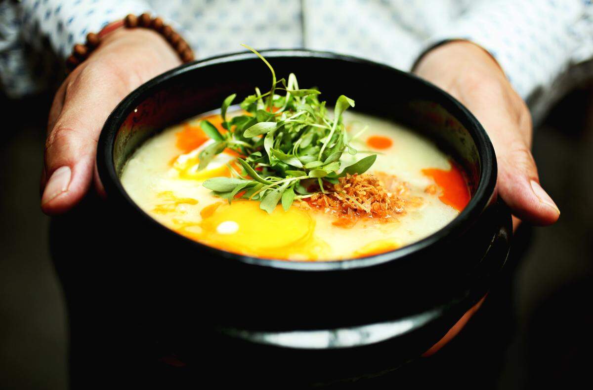 The Rice Congee made up of rice soup with chicken, ginger, herbs and egg at Brewery Bhavana.