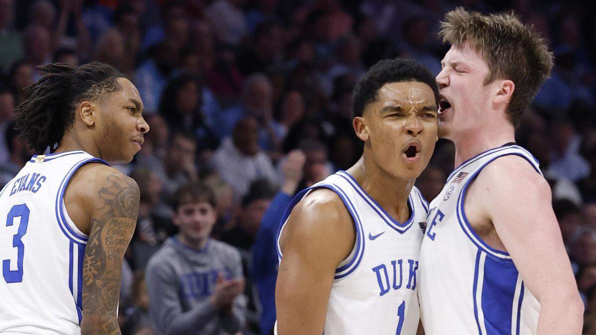 Duke’s Caleb Foster (1) celebrates with Kon Knueppel (7) during the first half of Duke’s game against UNC in the semifinals of the 2025 ACC Men’s Basketball Tournament at the Spectrum Center in Charlotte, N.C., Friday, March 14, 2025.