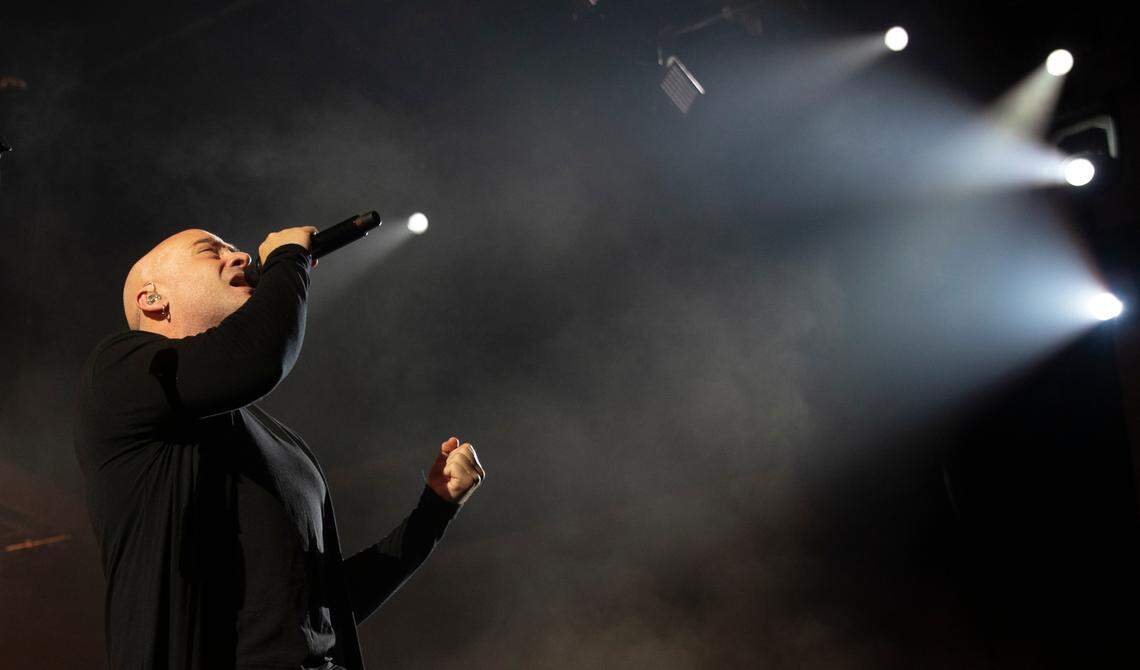 David Draiman emerges from the stage haze as Disturbed brings their “Take Back Your Life Tour” to Raleigh, N.C.’s Coastal Credit Union Music Park at Walnut Creek, Wednesday night, Sept. 6, 2023.