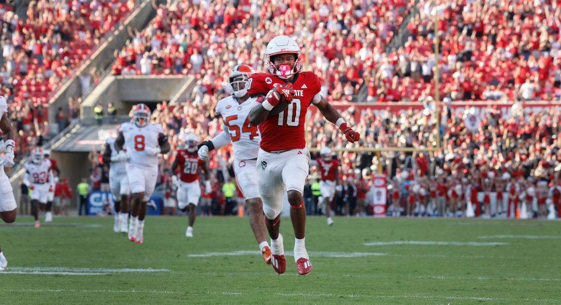 N.C. State wide receiver KC Concepcion (10) heads to the end zone to score on a 72-yard touchdown reception during the second half of N.C. State’s 24-17 victory over Clemson at Carter-Finley Stadium in Raleigh, N.C., Saturday, Oct. 28, 2023.