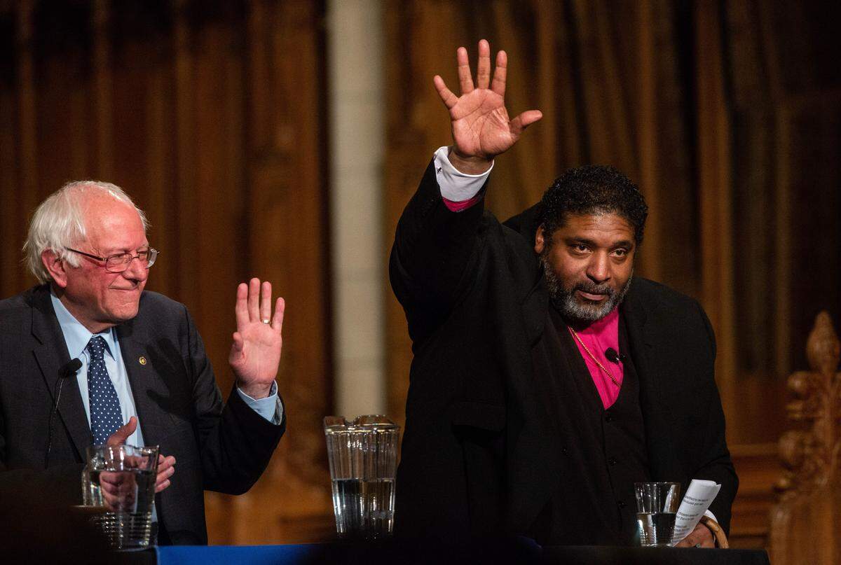 U.S. Sen. Bernie Sanders, left, and the Rev. William J. Barber II participate in a public forum Thursday, April, 19, 2018 at Duke Chapel in Durham.