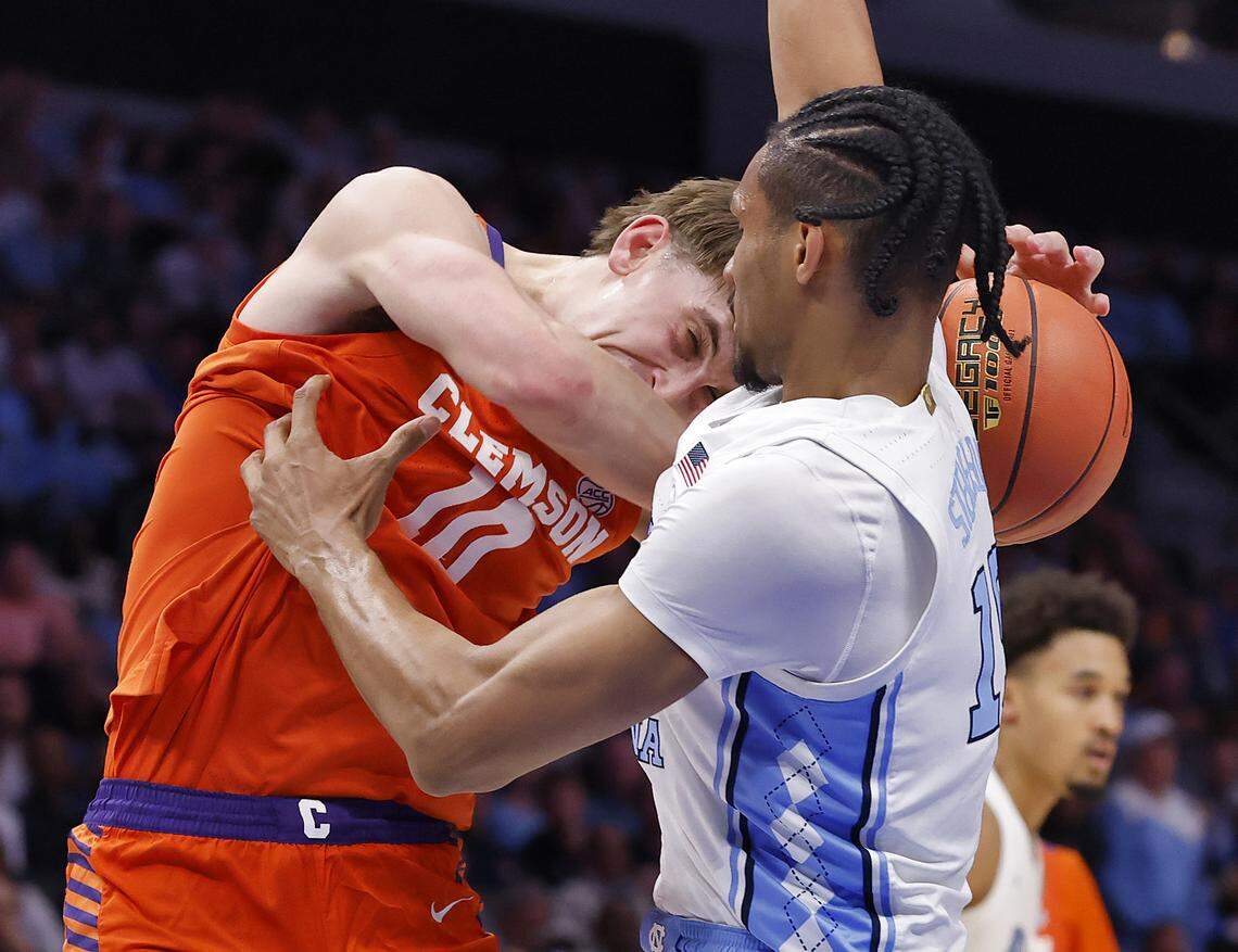 North Carolina's Jarin Stevenson fouls Clemson's Jake Wahlin during the first half of the Tar Heels’ 80-79 loss in the ACC Tournament quarterfinals on Thursday, March 12, 2026, at the Spectrum Center in Charlotte, N.C. 