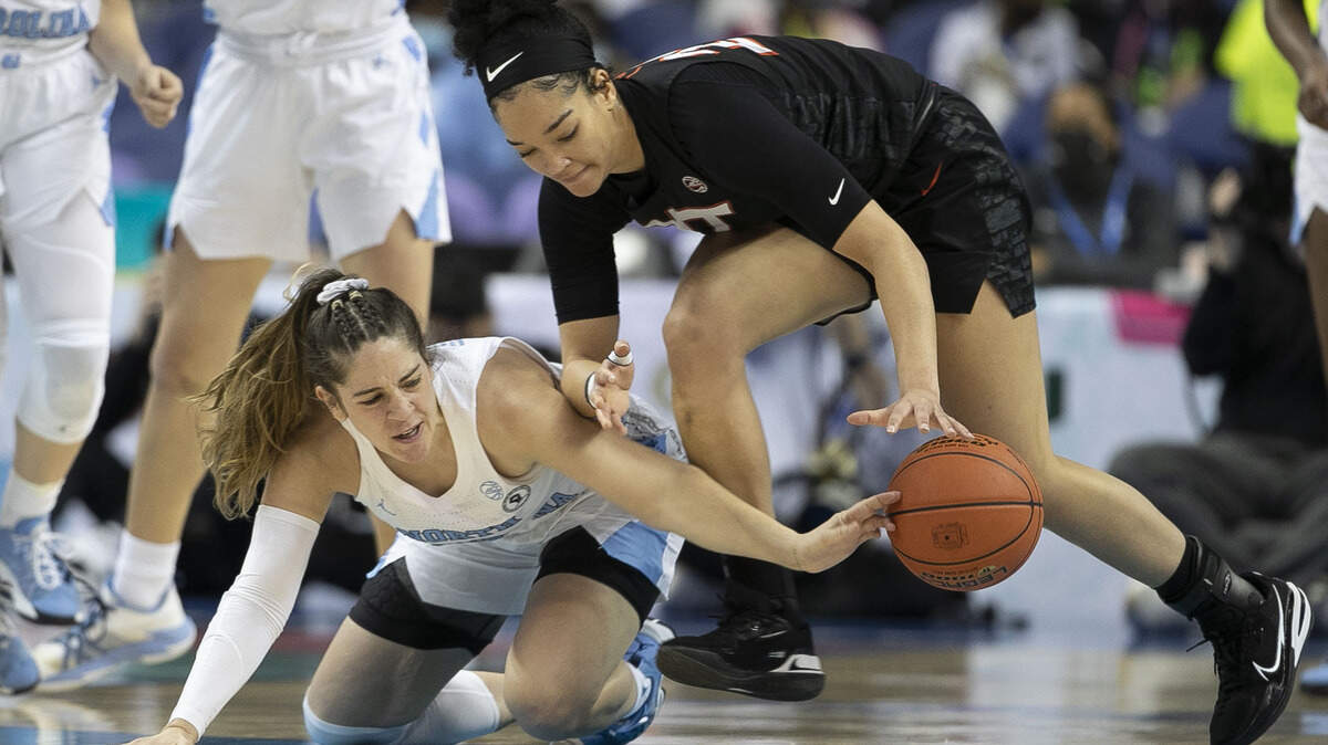 North Carolina’s Eva Hodgson (10) battles for a loose ball with Virginia Tech’s Emily Lytle (24) during the first half of the quarterfinal of the ACC Women’s Tournament on Friday, March 4, 2022 at the Greensboro Coliseum in Greensboro, N.C.
