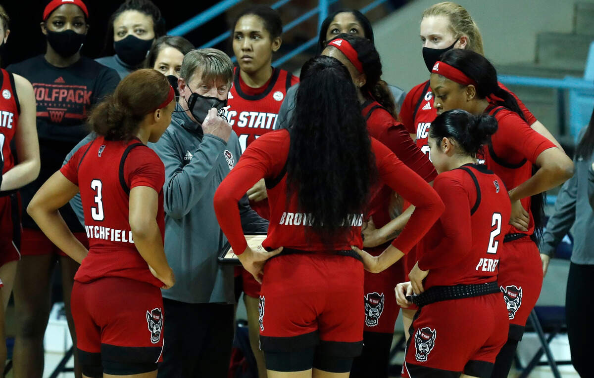 N.C. State head coach Wes Moore talks with his team during the second half of UNC’s 76-69 victory over N.C. State at Carmichael Arena in Chapel Hill, N.C., Sunday, February 7, 2021.