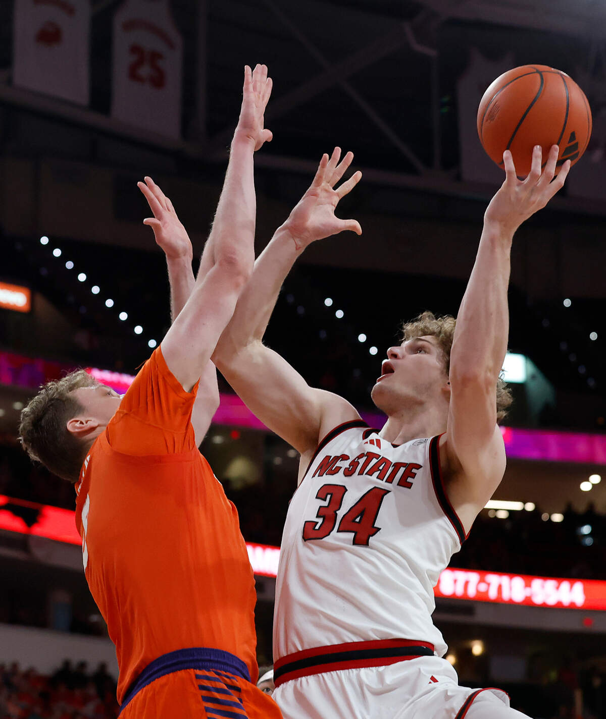 N.C. State’s Ben Middlebrooks looks to shoot over Clemson’s Viktor Lakhin during the second half of the Wolfpack’s 68-58 loss on Saturday, Feb. 1, 2025, at Lenovo Center in Raleigh, N.C.