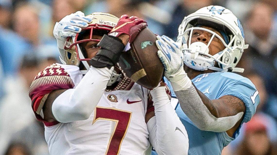 Florida State’s Jarrian Jones (7) intercepts a Sam Howell pass intended for Khafre Brown (1) in the second quarter on Saturday, October 9, 2021at Kenan Stadium in Chapel Hill, N.C.